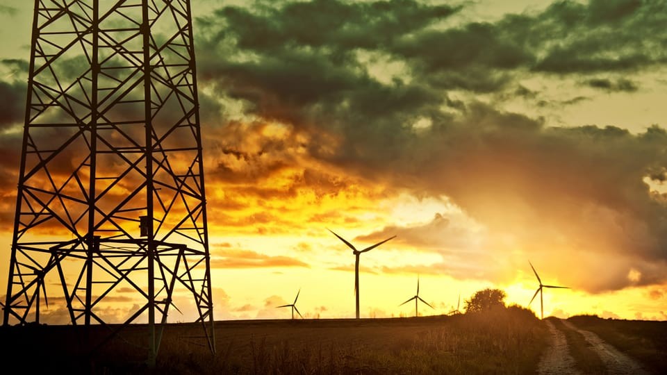 electricity pylon and wind turbine