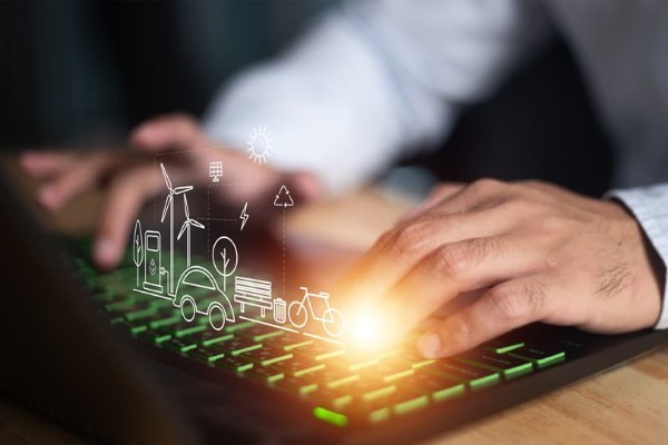man typing on a laptop